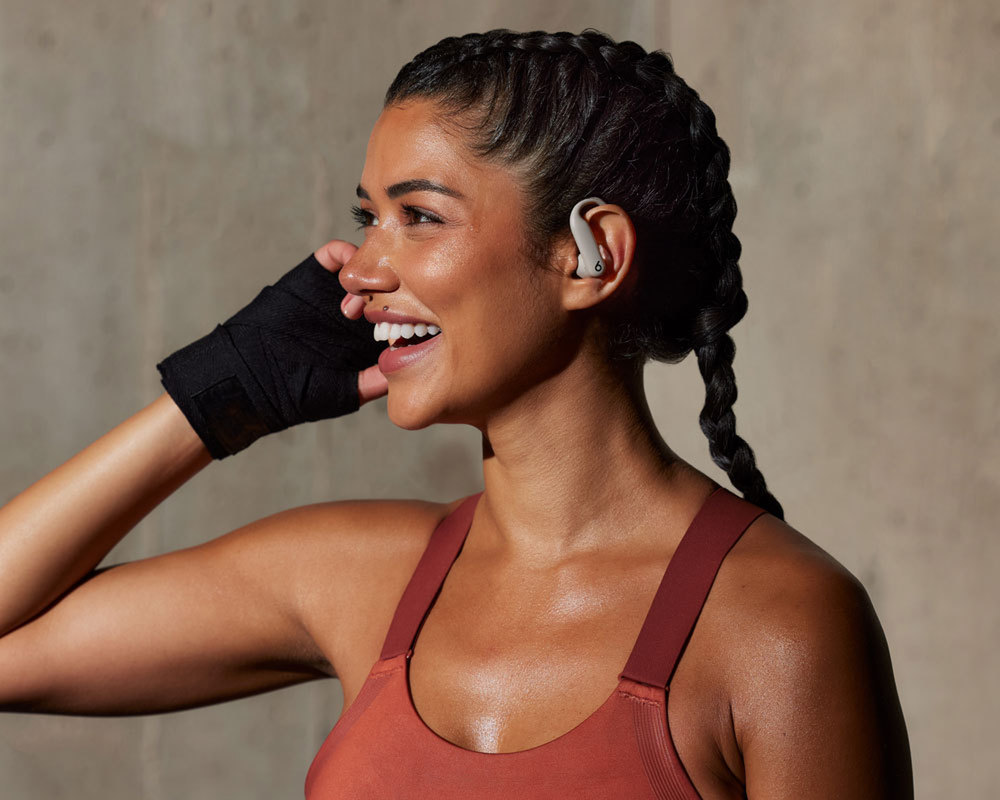 Person smiling wearing Powerbeats Pro 2